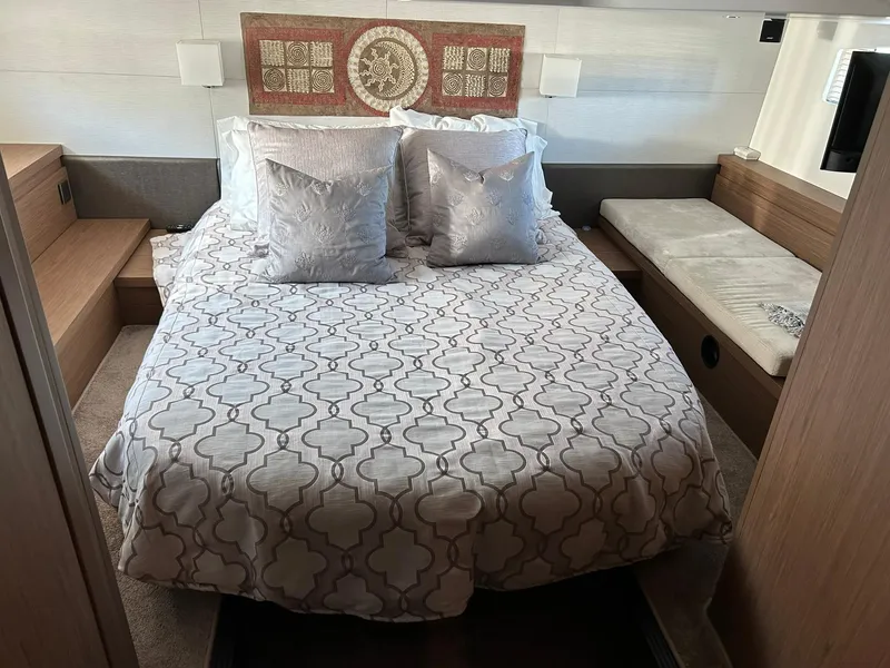 Slide: The Image of Luxurious bedroom interior of 2019 Beneteau Gran Turismo 46 yacht with elegant bedding. - 16