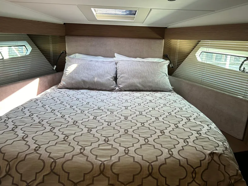 Slide: The Image of Luxurious bedroom interior of 2019 Beneteau Gran Turismo 46 yacht with elegant bedding. - 21