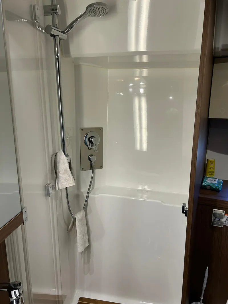 Slide: The Image of Shower area in 2019 Beneteau Gran Turismo 46 yacht, featuring modern fixtures and sleek design. - 25