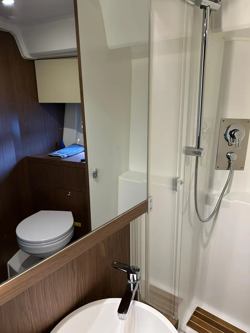 Slide: The Image of 2019 Beneteau Gran Turismo 46 bathroom with shower, sink, and toilet. - 26