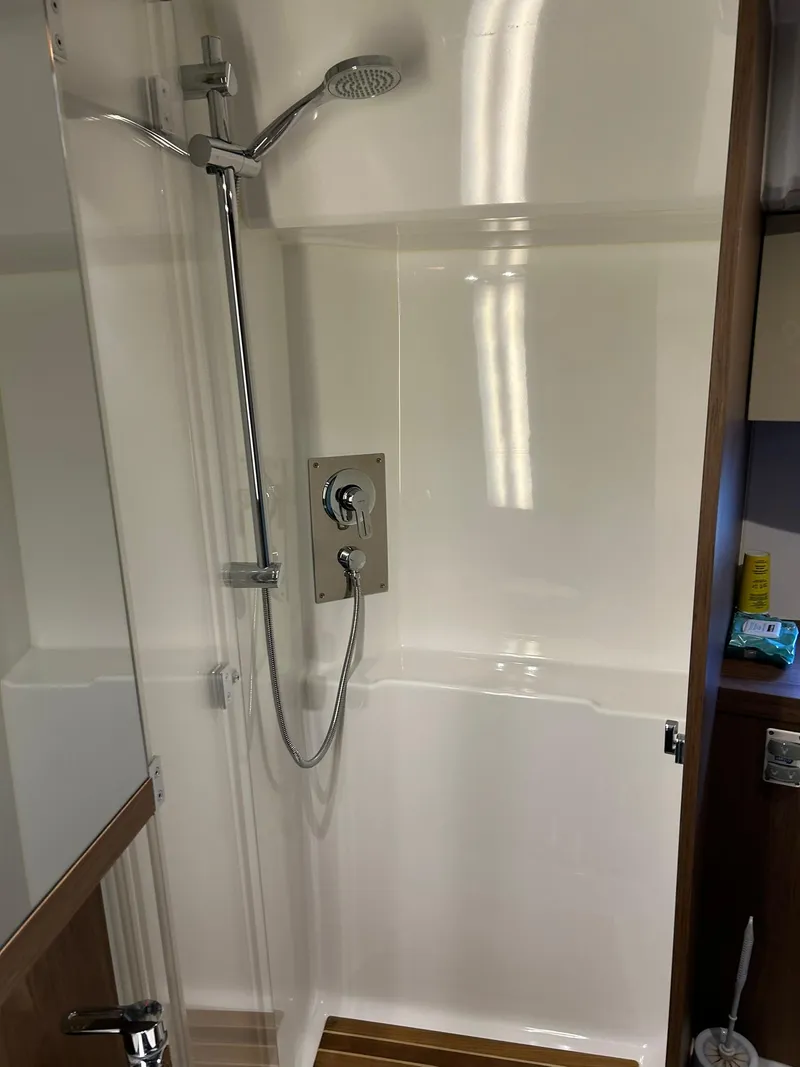 Slide: The Image of Shower area in 2019 Beneteau Gran Turismo 46 yacht, featuring modern fixtures and sleek design. - 27