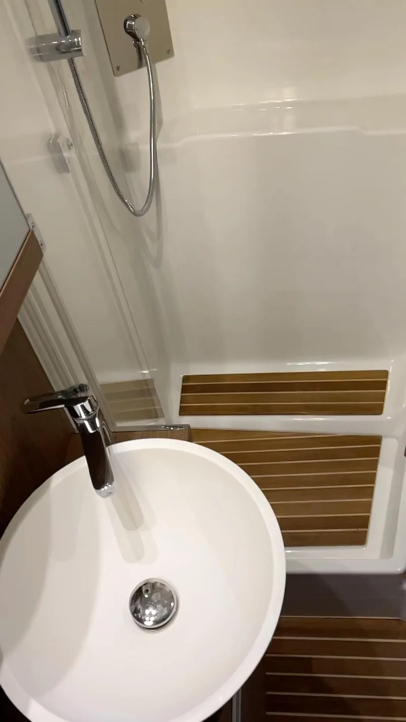 Slide: The Image of 2019 Beneteau Gran Turismo 46 bathroom with modern sink and shower. - 30