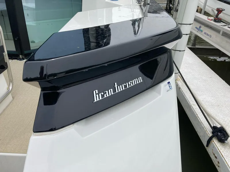 Slide: The Image of 2019 Beneteau Gran Turismo 46 yacht, sleek design, docked at marina. - 5