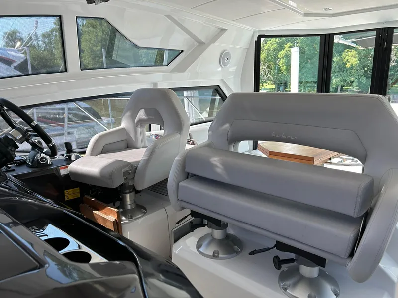Slide: The Image of Interior of 2019 Beneteau Gran Turismo 46 yacht with modern seating and large windows. - 8
