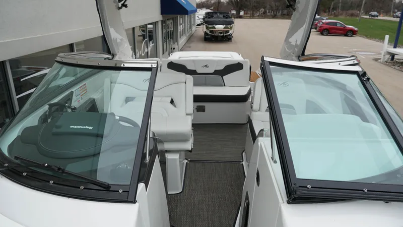Slide: The Image of 2016 Monterey 328SS boat interior with white seating and sleek design. - 11