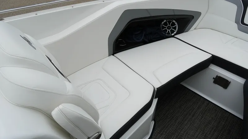Slide: The Image of 2016 Monterey 328SS boat interior with white seating and speaker. - 17