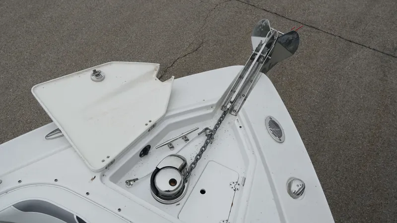 Slide: The Image of 2016 Monterey 328SS boat anchor system on deck, featuring chain and winch. - 19