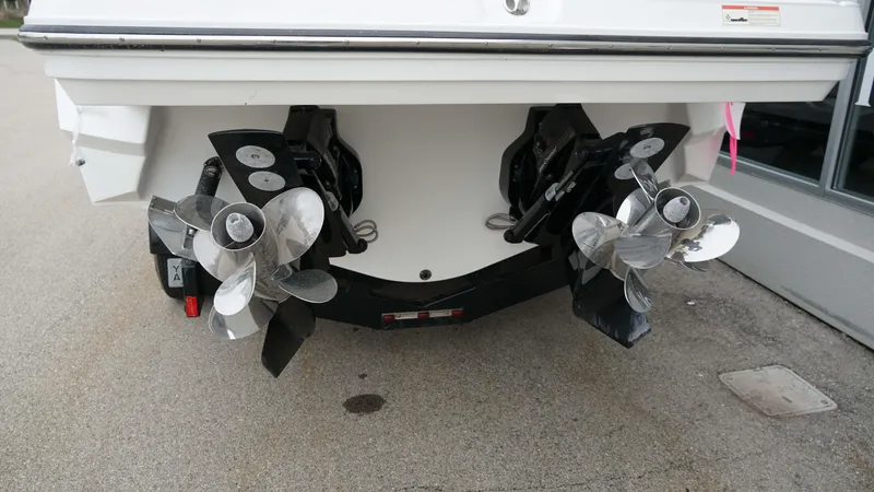 Slide: The Image of Rear view of 2016 Monterey 328SS boat showing dual propellers and outdrives. - 20
