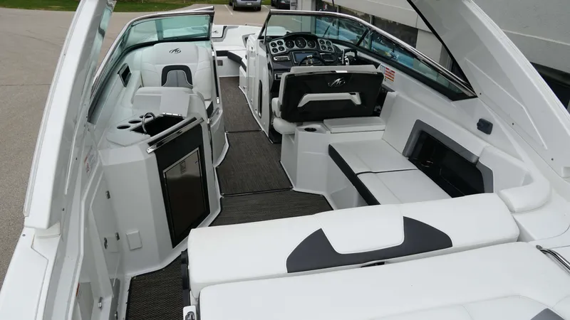 Slide: The Image of 2016 Monterey 328SS boat interior with white seating and modern dashboard. - 5