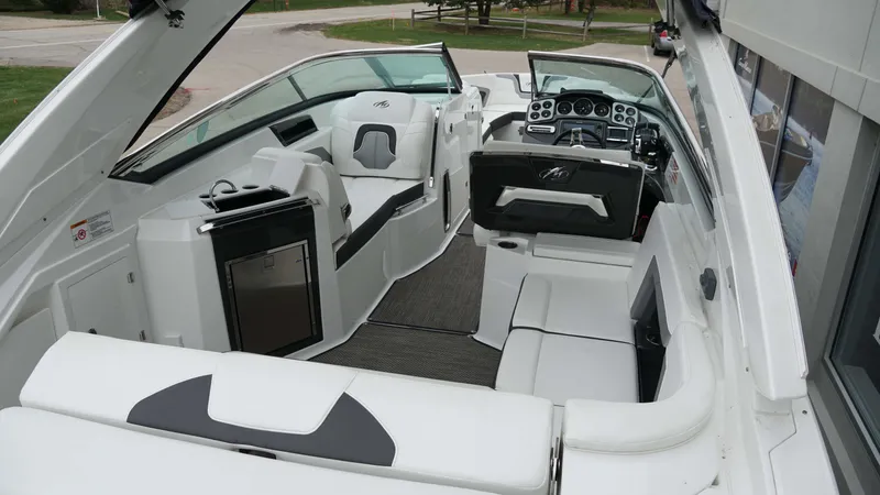 Slide: The Image of 2016 Monterey 328SS boat interior with modern seating and dashboard. - 6
