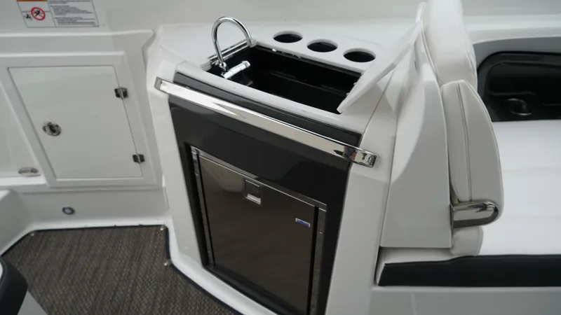 Slide: The Image of 2016 Monterey 328SS boat interior with sink and storage area. - 8