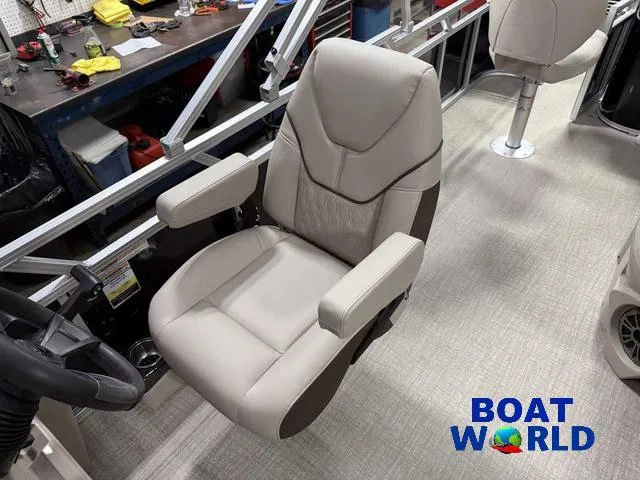 Slide: The Image of 2025 Tahoe Sport 2185 boat interior with comfortable captain's chair, labeled "Boat World." - 12