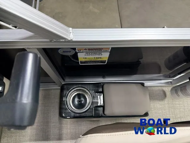 Slide: The Image of 2025 Tahoe Sport 2185 boat interior with cup holder and seating, featuring Boat World branding. - 16