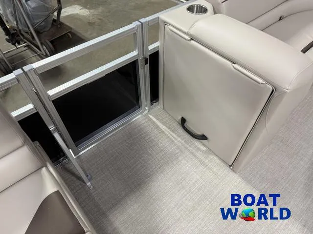 Slide: The Image of 2025 Tahoe Sport 2185 boat interior with beige seating and cup holder, featuring Boat World logo. - 24