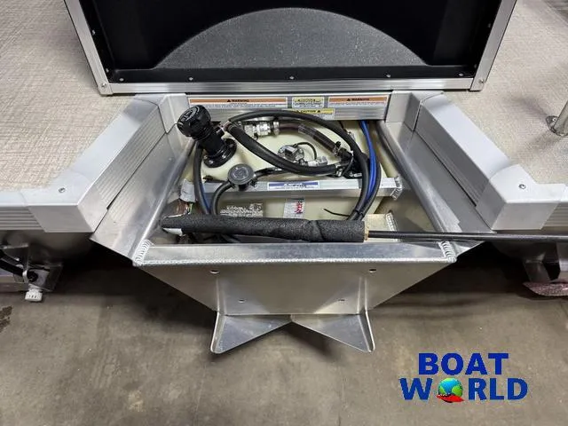 Slide: The Image of 2025 Tahoe Sport 2185 Rear Fish boat storage compartment with Honda 4-Stroke EFI engine components. - 40