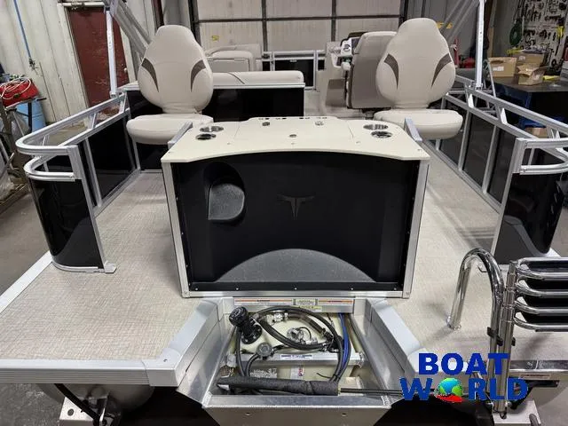 Slide: The Image of 2025 Tahoe Sport 2185 Rear Fish boat interior with Honda 4-Stroke EFI engine, in a showroom. - 41