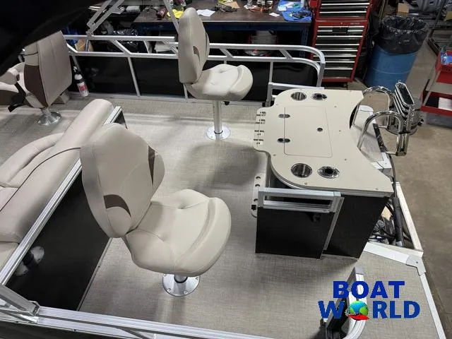 Slide: The Image of 2025 Tahoe Sport 2185 Rear Fish boat interior with seating and fishing station. - 5