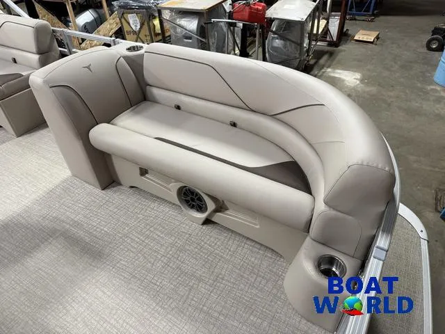 Slide: The Image of 2025 Tahoe Sport 2185 boat interior with plush seating and integrated speaker system. - 9