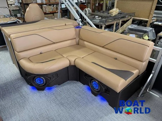Slide: The Image of Luxurious seating on 2025 Tahoe Sport 2385 Tritoon with ambient blue lighting. - 10