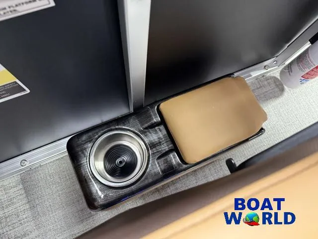 Slide: The Image of Cup holder and storage compartment on 2025 Tahoe Sport 2385 Rear Fish Tritoon. - 16