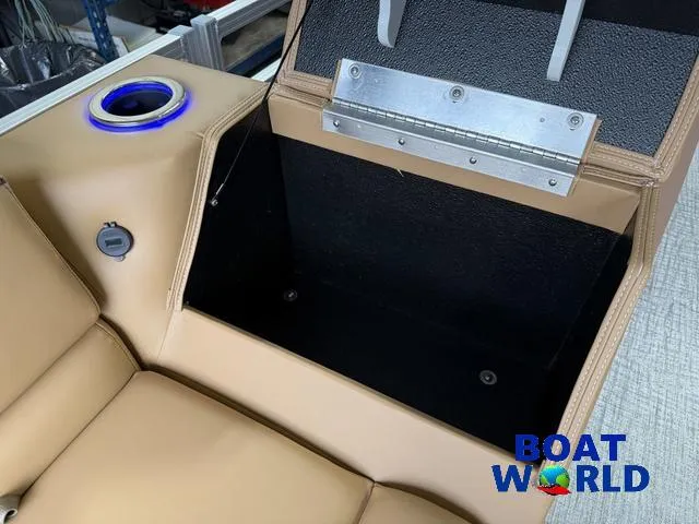 Slide: The Image of Tan seating with storage compartment on 2025 Tahoe Sport 2385 Tritoon boat. - 29