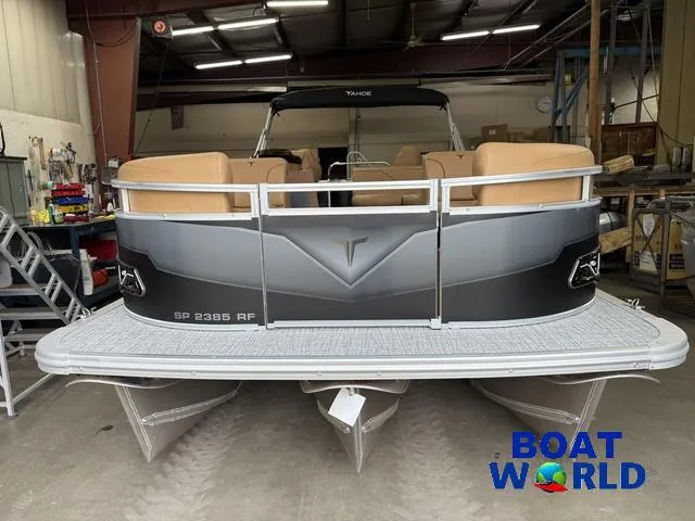 Slide: The Image of 2025 Tahoe Sport 2385 Rear Fish Tritoon in showroom, featuring Honda 4-Stroke EFI engine. - 33