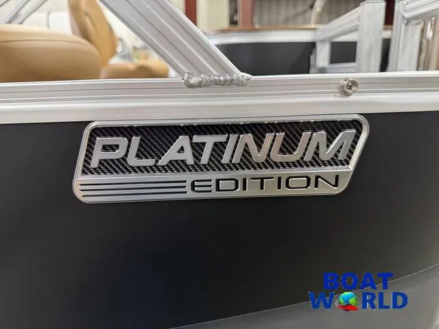 Slide: The Image of 2025 Tahoe Sport 2385 Tritoon Platinum Edition badge, Boat World logo visible. - 37