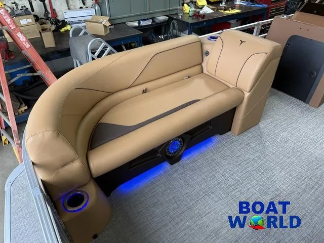 Slide: The Image of Luxurious seating in 2025 Tahoe Sport 2385 Tritoon with ambient blue lighting. - 8