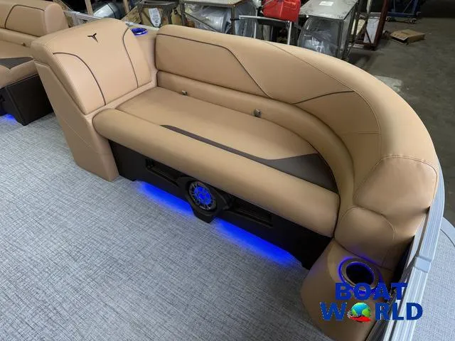 Slide: The Image of Luxurious seating on 2025 Tahoe Sport 2385 Tritoon with ambient blue lighting. - 9