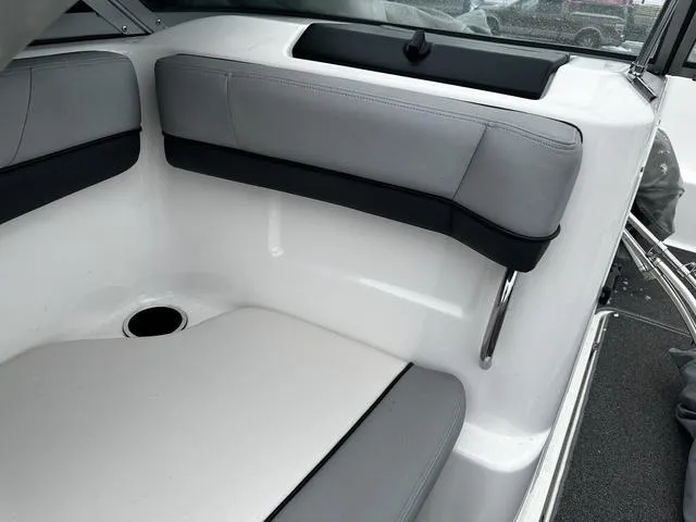 Slide: The Image of Interior seating of 2012 Yamaha Boats 212X, featuring gray and black upholstery. - 11