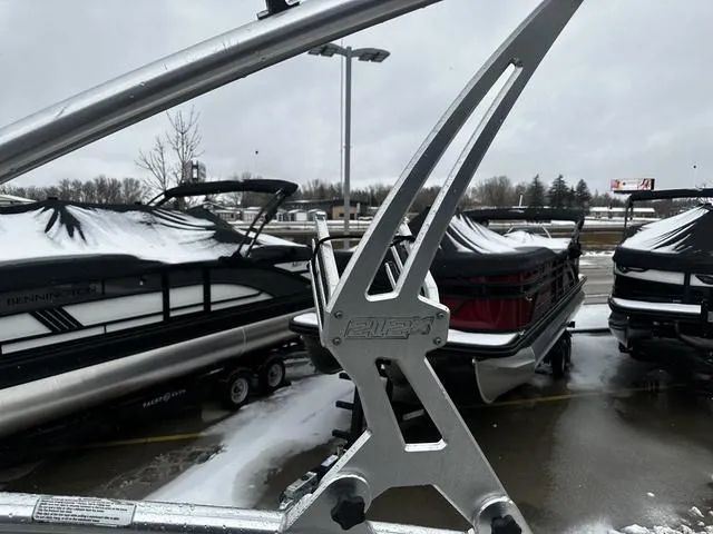 Slide: The Image of Snow-covered Yamaha Boats 212X, 2012 model, in a wintery marina setting. - 14