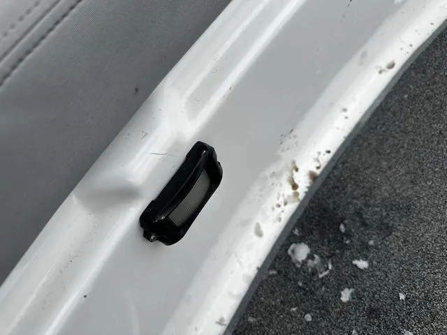 Slide: The Image of Close-up of a 2012 Yamaha Boats 212X interior detail with dirt and wear. - 18