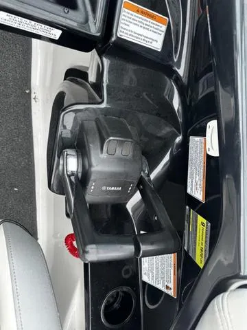 Slide: The Image of Yamaha Boats 212X 2012 throttle control with safety warnings and labels. - 19