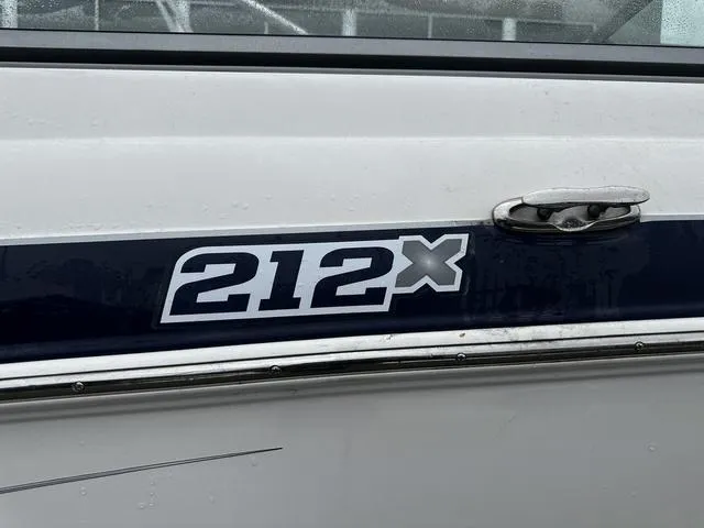Slide: The Image of Close-up of 2012 Yamaha Boats 212X model name on boat exterior. - 4