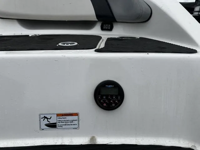 Slide: The Image of Yamaha Boats 2012 212X swim platform with control panel and safety warning label. - 7
