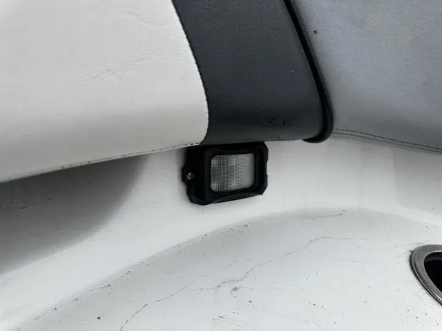 Slide: The Image of Interior detail of a 2012 Yamaha Boats 212X, featuring a small light fixture. - 9