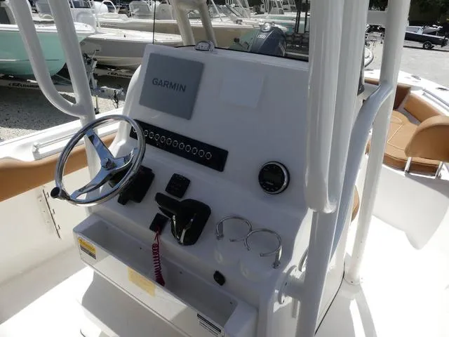 Slide: The Image of 2025 Key West 239 FS boat console with Garmin navigation system and steering wheel. - 11