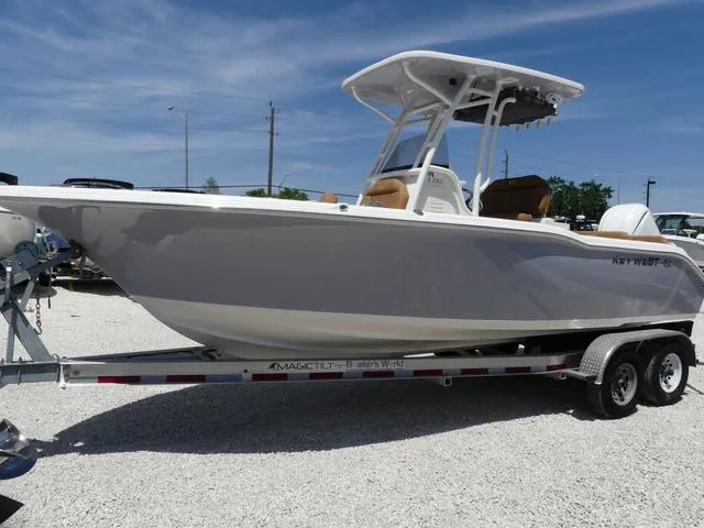 Slide: The Image of 2025 Key West 239 FS boat on trailer under clear blue sky. - 3