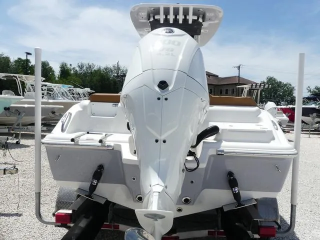 Slide: The Image of 2025 Key West 239 FS boat, rear view, on trailer, outdoors. - 5