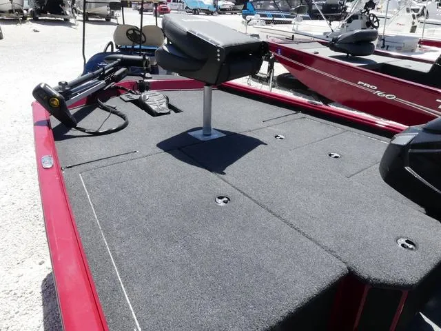 Slide: The Image of 2022 Lund 2175 Pro V boat deck with seating and fishing equipment. - 10