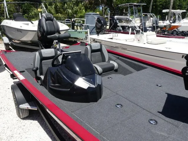 Slide: The Image of 2022 Lund 2175 Pro V boat with sleek design and comfortable seating. - 12