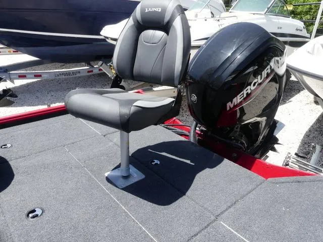 Slide: The Image of 2022 Lund 2175 Pro V boat with Mercury engine and swivel seat on deck. - 7