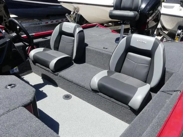 Slide: The Image of 2022 Lund 2175 Pro V boat interior with gray and black seating. - 9