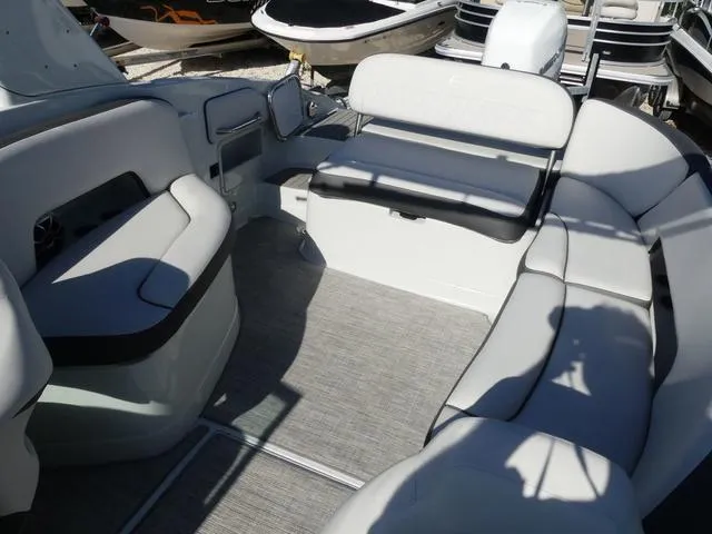 Slide: The Image of 2023 Crownline 290 XSS boat interior with spacious seating and modern design. - 10