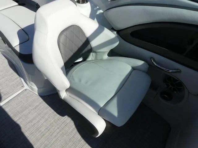 Slide: The Image of 2023 Crownline 290 XSS boat seat with gray upholstery and modern design. - 11