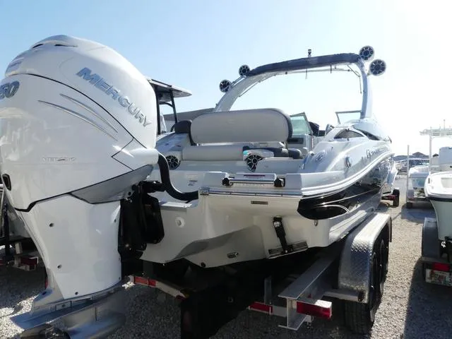 Slide: The Image of 2023 Crownline 290 XSS boat with Mercury engine on trailer, rear view. - 5