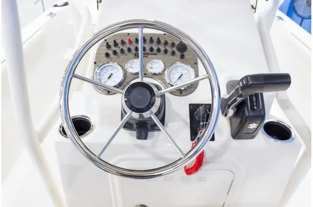 Slide: The Image of Steering console of 2021 Carolina Skiff 21LS boat with gauges and controls. - 11
