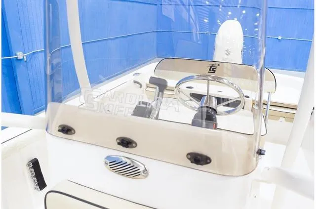 Slide: The Image of 2021 Carolina Skiff 21LS boat console with steering wheel and controls. - 15