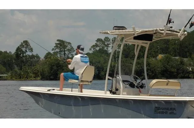 Slide: The Image of Man fishing on a 2021 Carolina Skiff 21LS boat in a scenic waterway. - 7