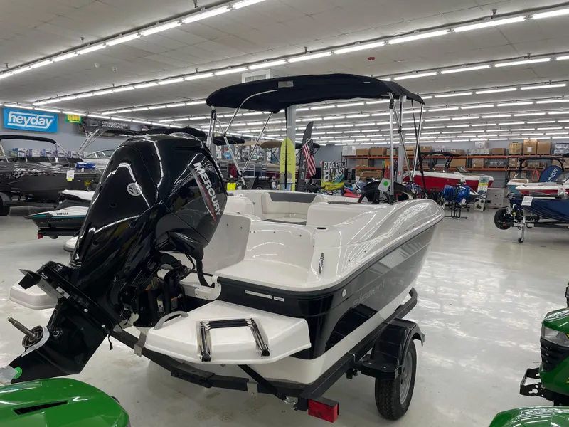 Slide: The Image of 2025 Bayliner Element E16 boat with Mercury engine in showroom. - 3